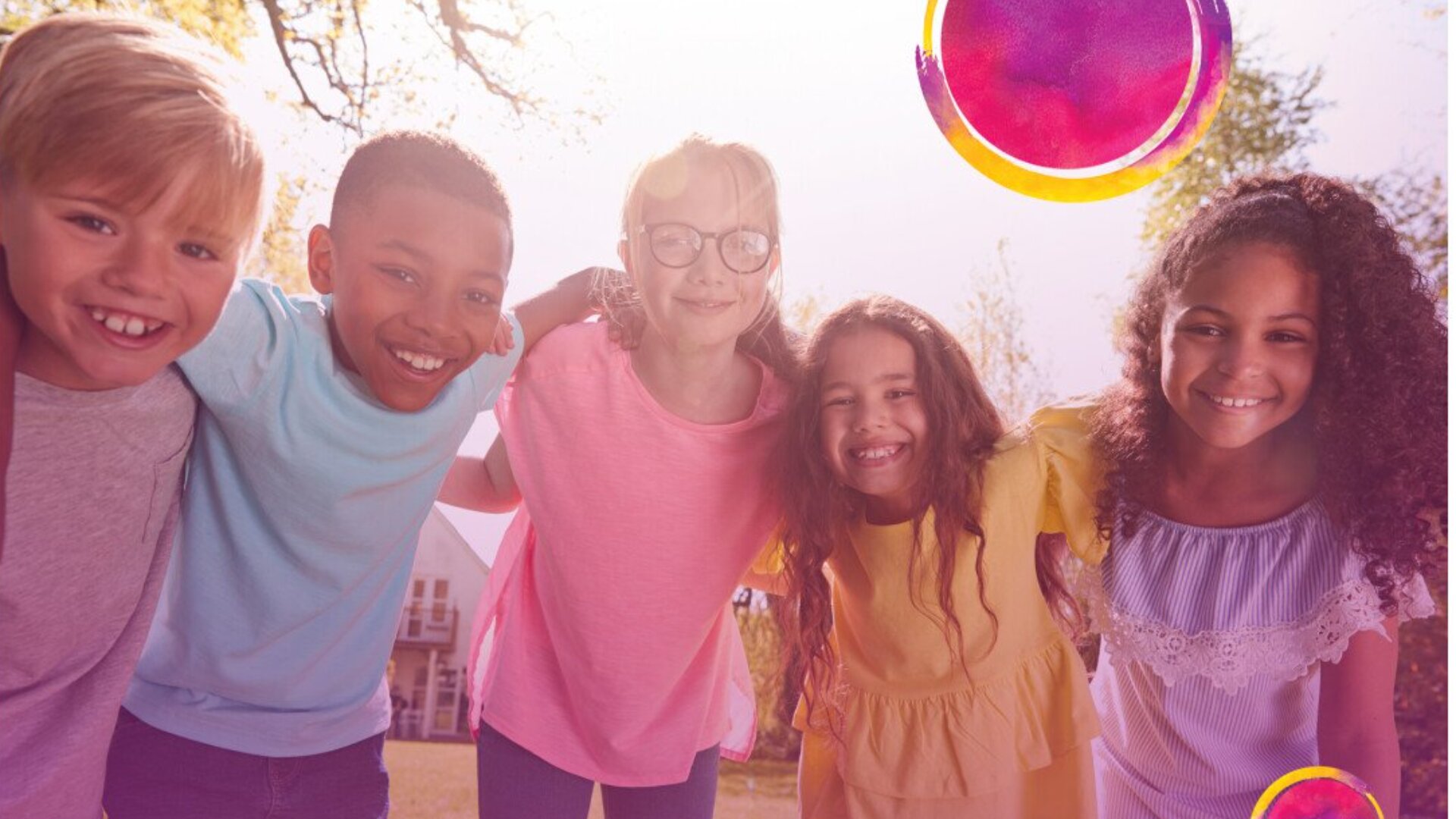 Five children stand outdoors with their arms around each other, smiling at the camera. The sun is shining, and colorful circular graphics decorate the upper right corner of the image.