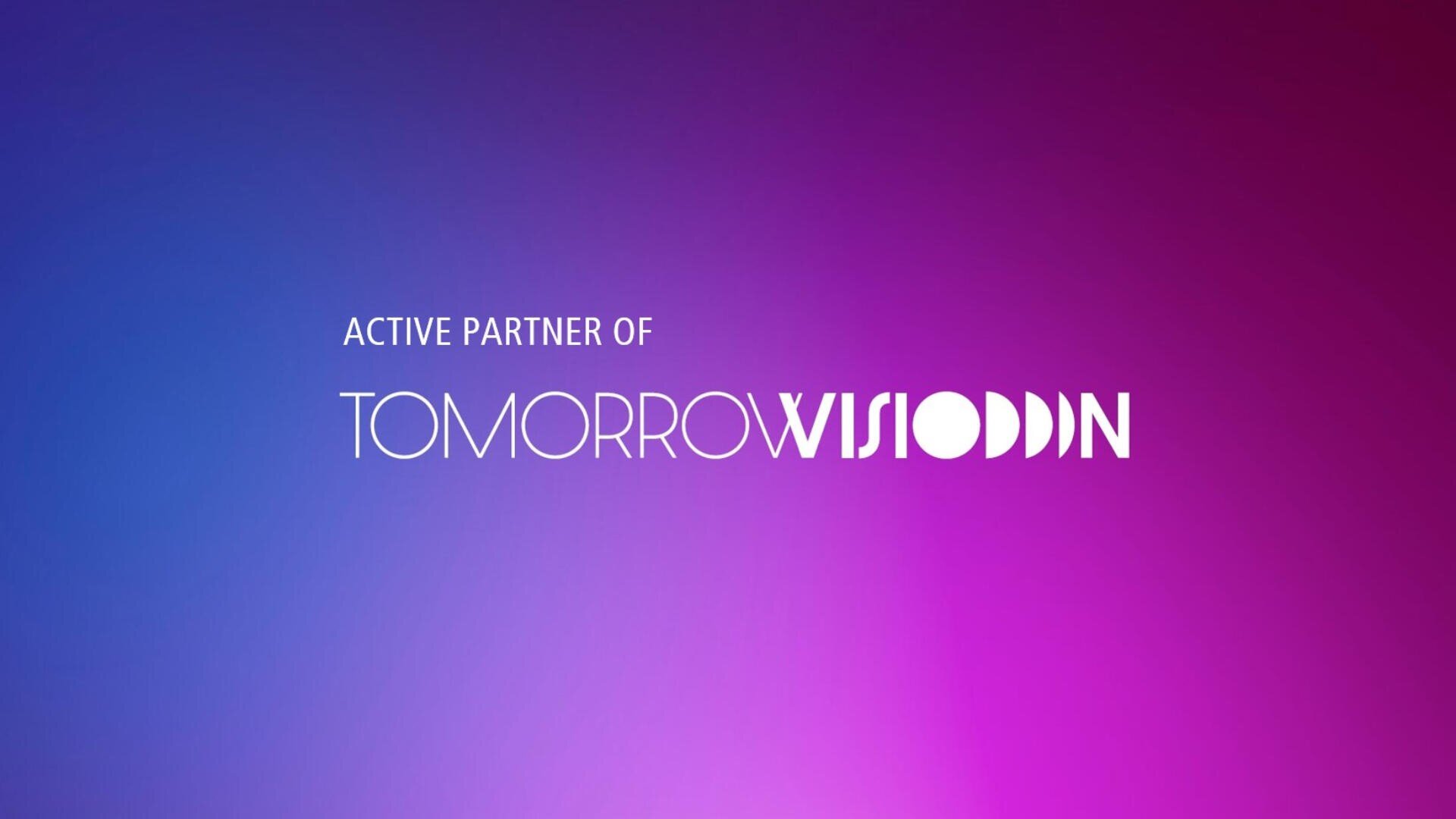 Weißer Text auf einem Hintergrund mit Farbverlauf von Blau nach Rosa lautet: ACTIVE PARTNER OF TOMORROW VISION, wobei VISION in einer stilisierten, fetten Schriftart steht.