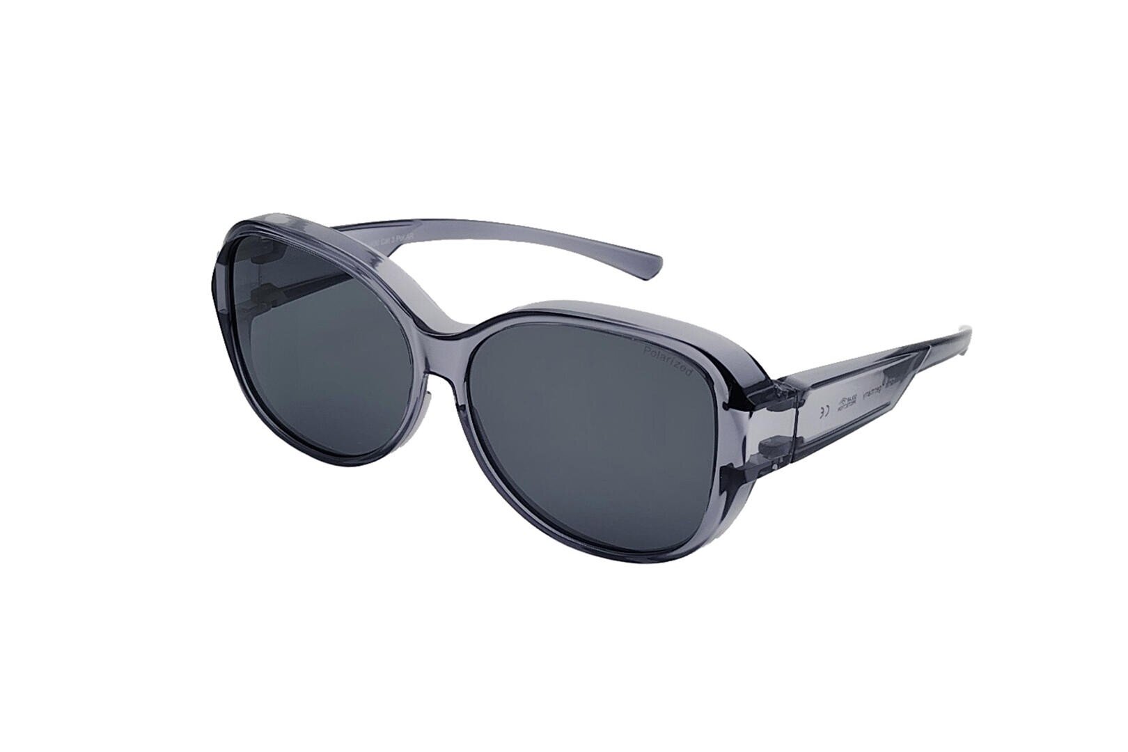 Eine stilvolle, übergroße Sonnenbrille mit dunklen, abgerundeten Gläsern und durchscheinenden grauen Kunststoffrahmen auf weißem Hintergrund.