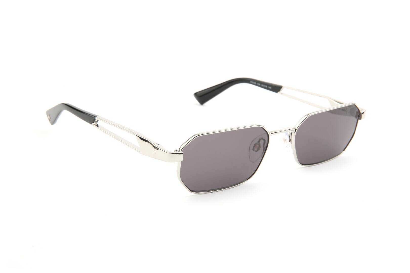 A pair of silver-framed sunglasses with geometric, slightly rounded rectangular dark lenses, and black tips on the arms, displayed on a white background.