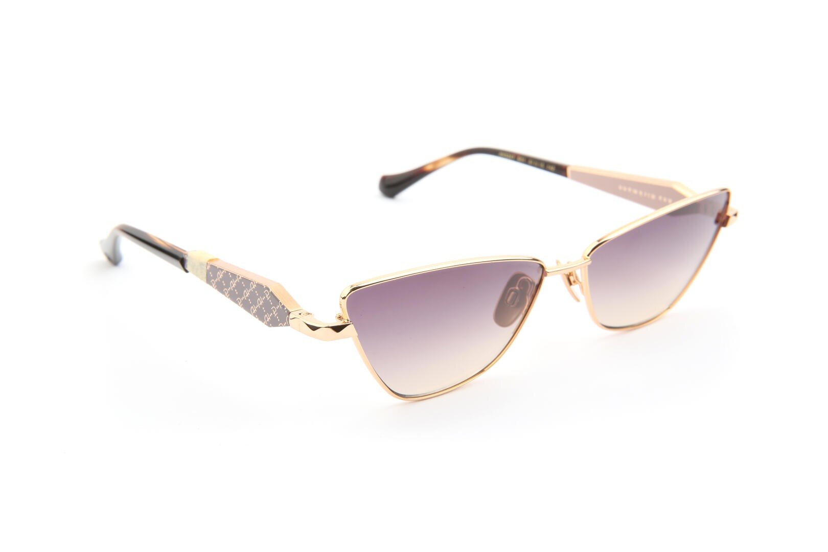 A pair of stylish cat-eye sunglasses with gold metal frames and gradient dark lenses, featuring decorative patterned arms, displayed on a white background.