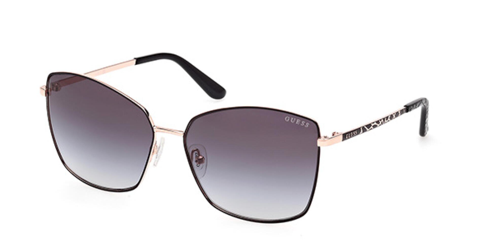 Eine Sonnenbrille von Guess mit dünnem, goldenem Metallrahmen, schwarzen Bügelenden und großen, quadratischen Verlaufsgläsern, die von dunkel nach hell verblassen.