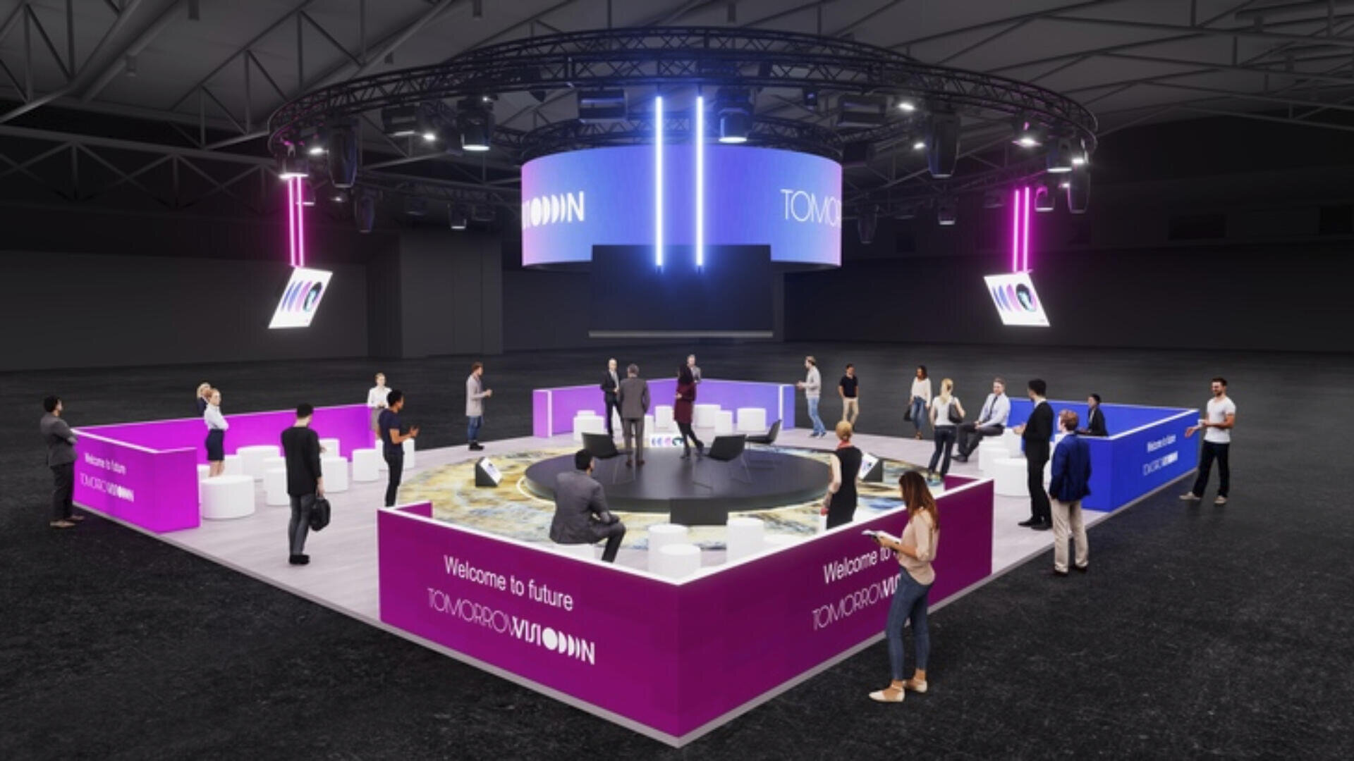 Ein modernes Indoor-Event-Setup mit Menschen, die um eine runde Bühne stehen und sitzen, umgeben von lila und weißen Bannern mit der Aufschrift „Welcome to future“ und „TOMORROW VISION“ unter großen Bildschirmen und hellen Lichtern.