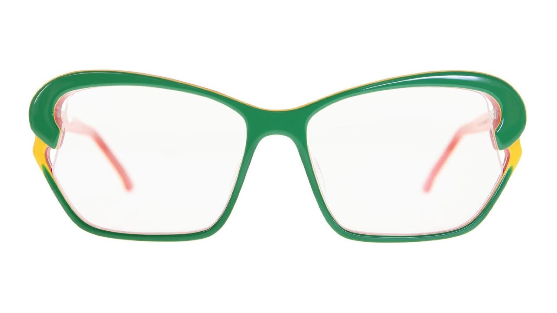 Green eyeglasses with large, angular frames, yellow accents on the edges, and pink-tinted lenses, shown against a white background.